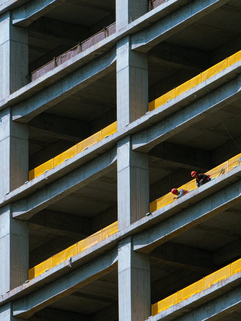 A man is standing on the balcony of a building